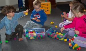 Preschool Activities – Fine Motor – Children Lacing Beads